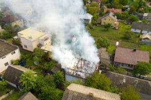 aerial view of a house on fire with orange flames 2022 03 16 19 52 50 utc
